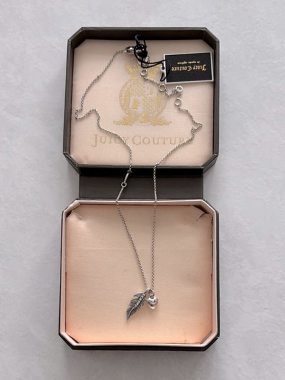 NWT Juicy Couture Feather Silver tone necklace